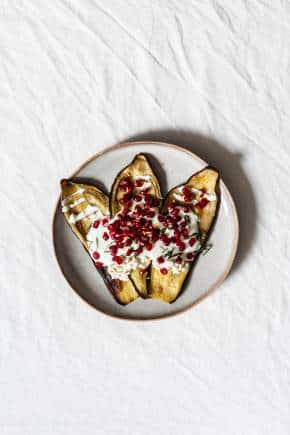 Brinjal leans soft, so adding crunchy elements such as almonds and pomegranate seeds help