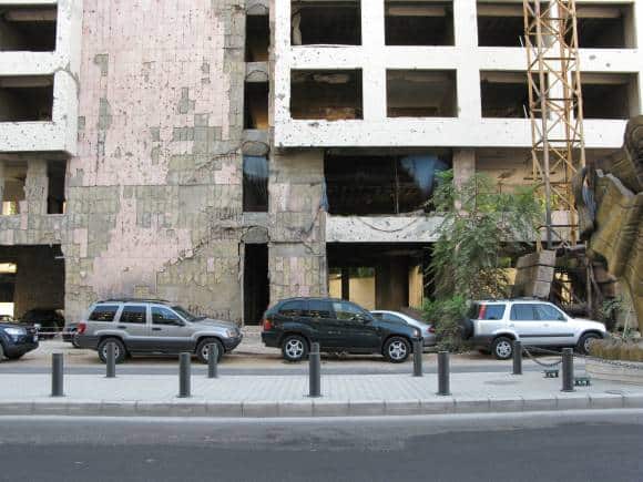 Remains of Lebanese Civil War, damaged buildings in central Beirut, Holiday Inn. After the fighting ceased, the building has become a popular site for underground dance parties. (Photo: Vyacheslav Argenberg)