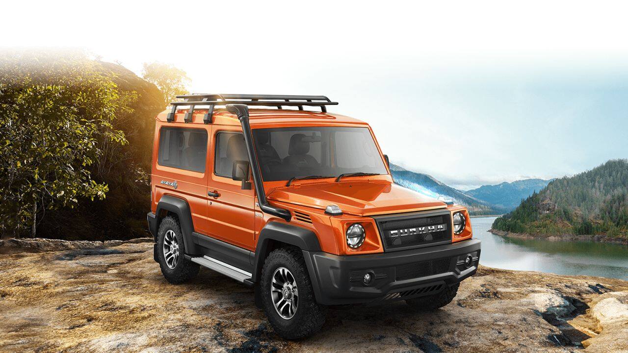 Force Gurkha 5-door | Launched last year, the Force Gurkha is all set to get a new 5-door variant. The SUV has been spotted testing multiple times already and some of the more recent sightings suggest a pickup variant should also come into the picture soon. For now, however, we’ll concentrate on the 5 doors. Now, this is essentially just a stretched out 3-door Gurkha, there are going to be a few changes. The front, for example, has been spotted sporting a set of square headlamps, unlike the round units on the 3-door version. The grille, however, remains the same as does the snorkel and 18-inch alloys. On the inside, we could see anything from a 5-seater to a 7-seater. The 4WD tech on offer also seems to be different as the 5-door test mule was spotted with a shift-on-the-fly knob positioned beside the driver’s seat on the centre-console. Powering the 5-door Gurkha is expected to be the same Mercedes-sourced powertrain. This 2.6-litre diesel is capable of producing 91 hp of maximum power and 250 Nm of peak torque. As far as rivals go, the Force Gurkha will compete against the Mahindra Thar 5-door variant and the Maruti Suzuki Jimny of which the 3-door variant isn’t available in India yet. (Image: Force)