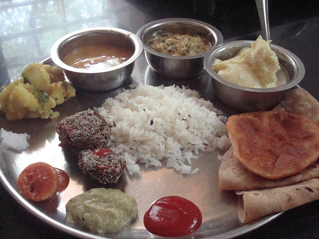 Thali with Shrikhand for dessert. (Photo by Dharmadhyaksha via Wikimedia Commons 4.0)