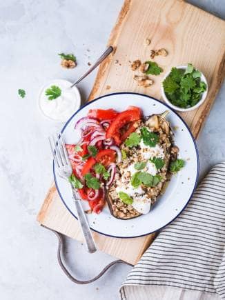Stuffed eggplant with yogurt and salad