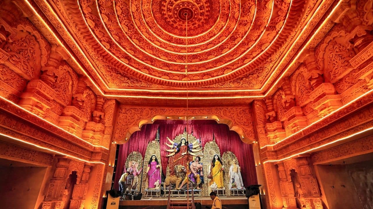 A Durga Puja pandal in the city of Joy brought Ayodhya's Ram Temple to life ahead of the Durga Puja celebration as the city is busy preparing for the auspicious festival. (Image: PTI) A Durga Puja pandal in the city of Joy brought Ayodhya's Ram Temple to life ahead of the Durga Puja celebration as the city is busy preparing for the auspicious festival. (Image: PTI)