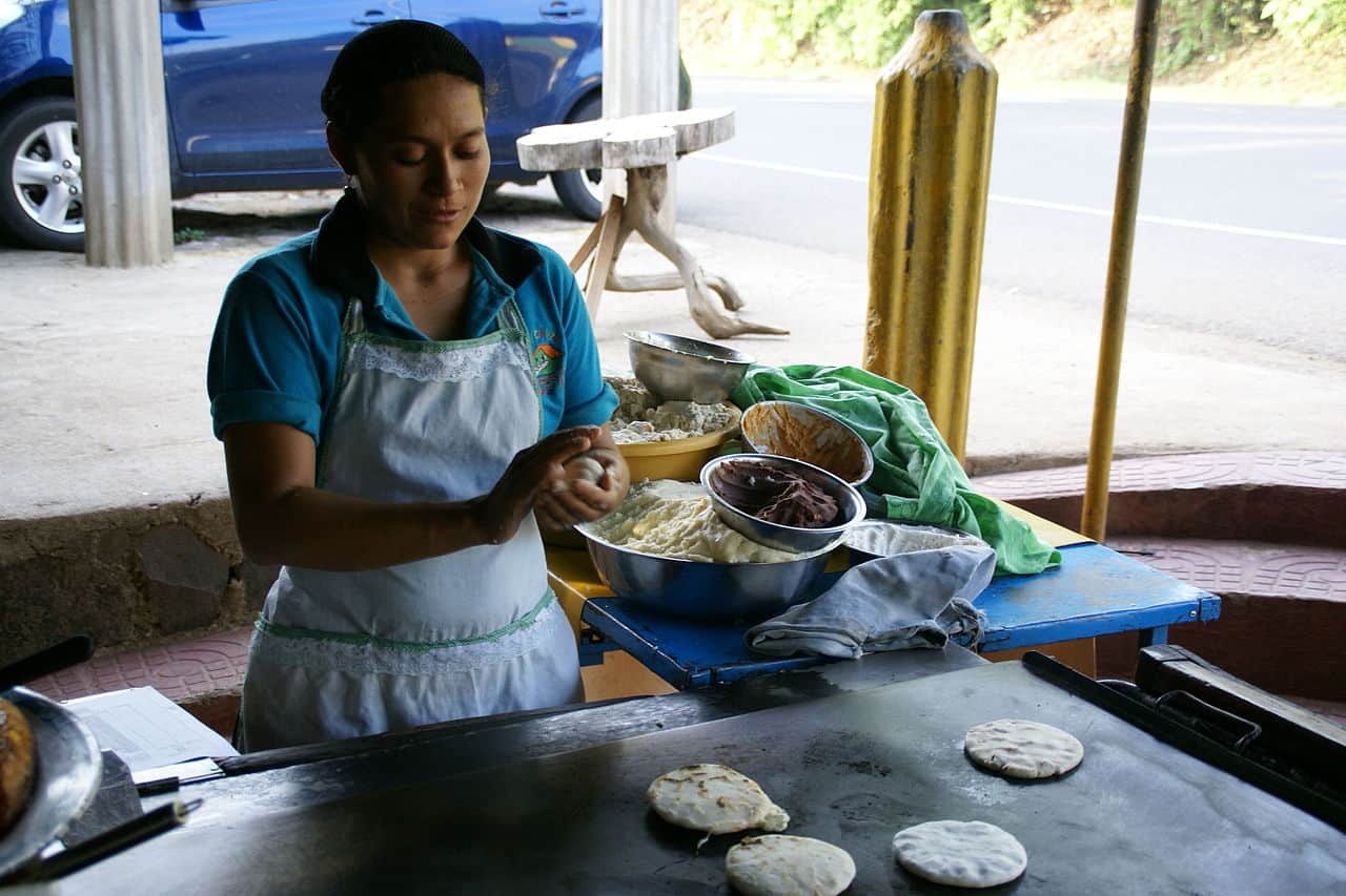 Pupusas are fried treats made with corn or rice flour and different fillings. (Photo by Hermann Luyken via Wikimedia Commons 3.0)