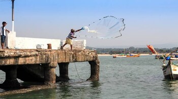 Sri Lankan Navy detains 12 Indian fishermen and seizes their trawlers on allegations of poaching in the island nation's waters, according to an official statement on Sunday.