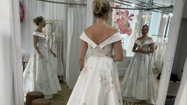Female Tailor Bride Trying Wedding Dress Wedding Salon Stock Photo by  ©ArturVerkhovetskiy 188139858