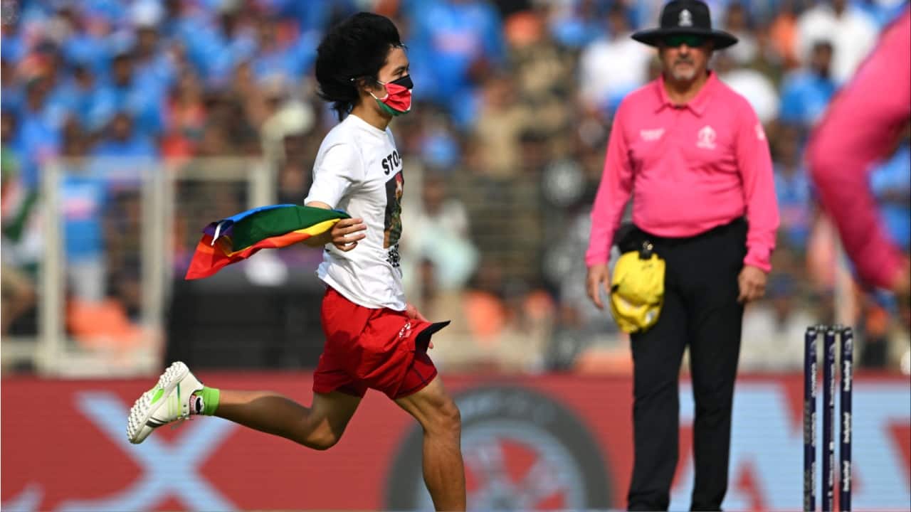 The pitch invader runs through the field during the 2023 ICC Men's Cricket World Cup one-day international (ODI) final match between India and Australia at the Narendra Modi Stadium in Ahmedabad on November 19.