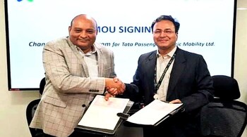 Representatives of Standard Chartered Bank, Tata Motors pose for a photograph after signing the MoU
