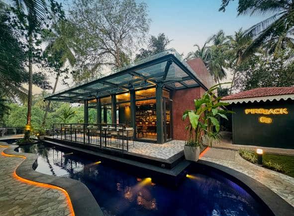 Dining by the koi fish pond at Fireback, Goa.