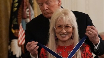 File photo of then US President Donald Trump presenting the Presidential Medal of Freedom to physician Miriam Adelson, on November 16, 2018, in Washington, DC. The award is the nation's highest civilian honor that is presented to individuals who have made significant contributions to the United States of America. (Image credit: AFP)
