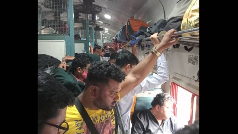 Man with confirmed ticket forced to stand for entire train journey: 'couldn't even reach seat' - Vimarsana News