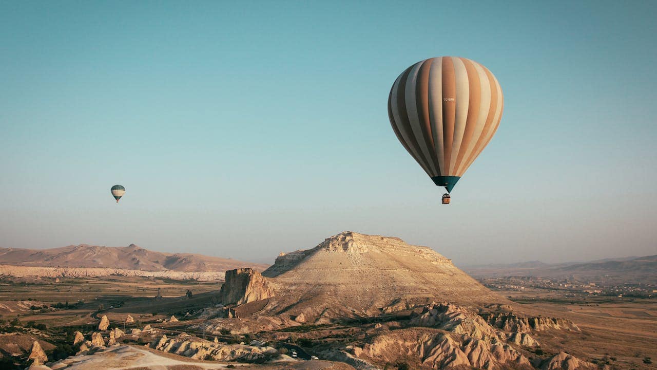 Cappadocia in Turkey offers hot-air balloon rides and cave hotels that can host mid-sized groups of 100-150 people. (Photo by Francesco Ungaro via Pexels)