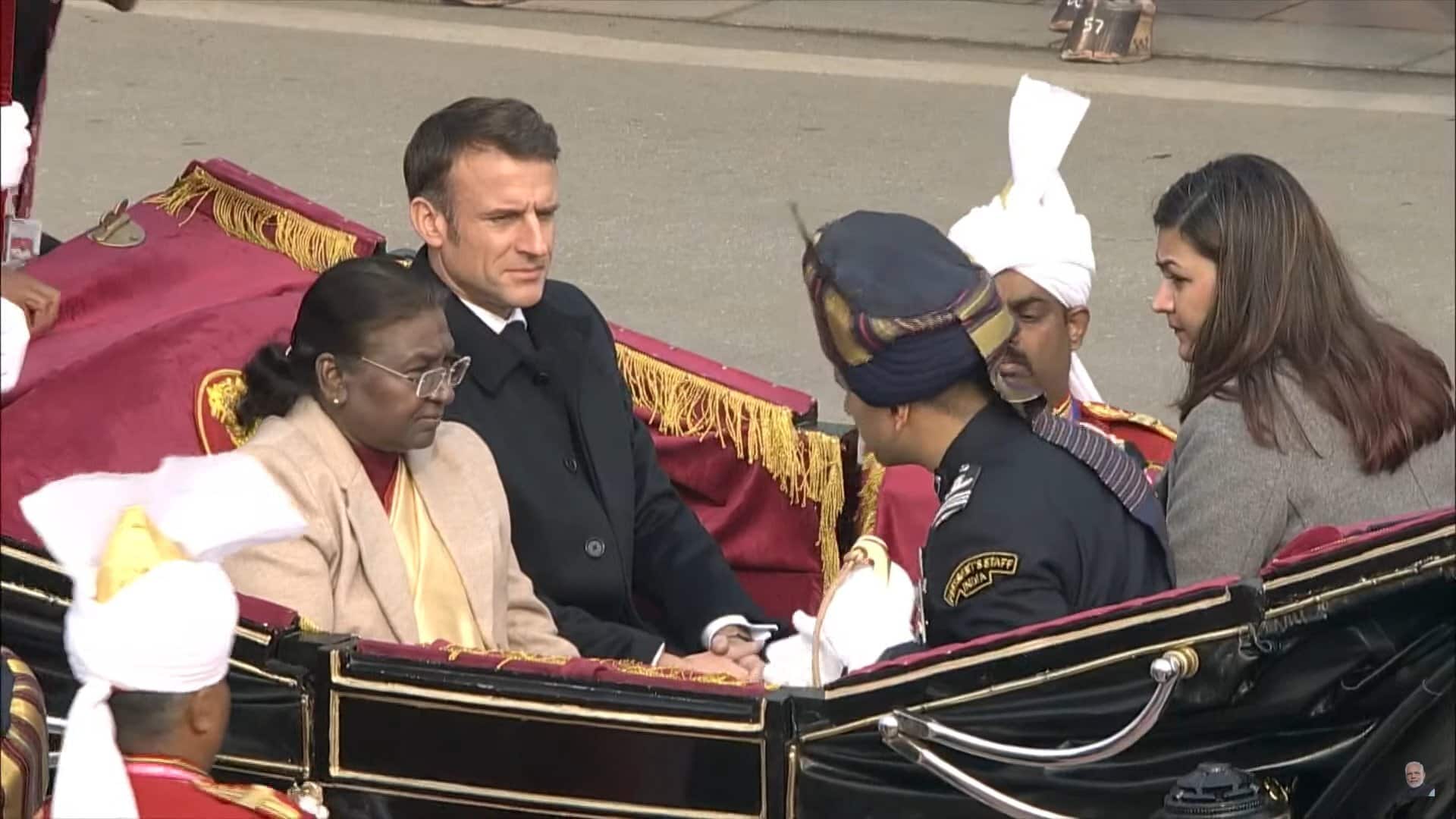 French President Emmanuel Macron, the chief guest, observes the majestic military parade and cultural performances alongside President Droupadi Murmu, Prime Minister Narendra Modi, Union Cabinet members, foreign diplomats, and esteemed dignitaries at the Republic Day ceremony. (Image: ANI)