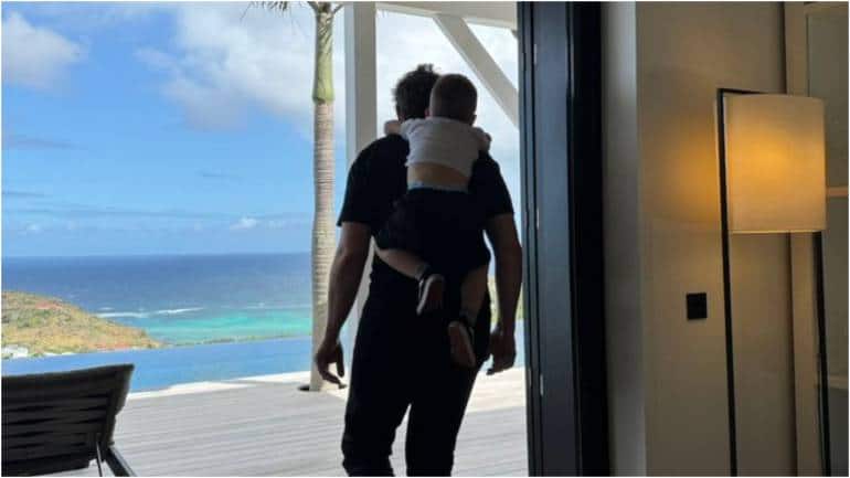Elon Musk gives piggyback ride to 3-year-old son in adorable pic, fondly calls him 'Lil X' - Vimarsana News