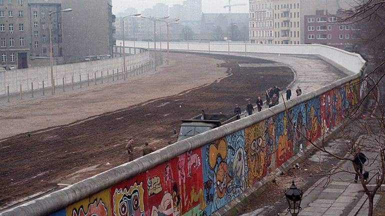 The Berlin Wall was a guarded concrete barrier that encircled West Berlin of the Federal Republic of Germany from 1961 to 1989, separating it from East Berlin and the German Democratic Republic. (Photo: Wikimedia Commons)