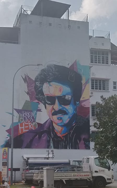 Working Class Hero, the mural by Mohammed Zulkarnaen Bin Othman (Zero) is splashed on a wall in Singapore’s Little India.