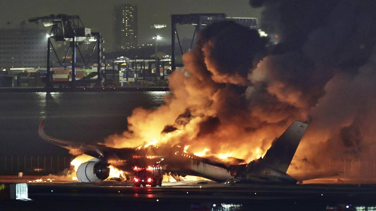 'Smoke in the cabin stung like hell': 17-year-old flier evacuated from Japan's burning plane. Video