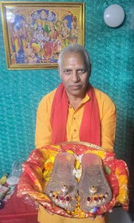 Challa Srinivas Sastry with Lord Rama's padukas.