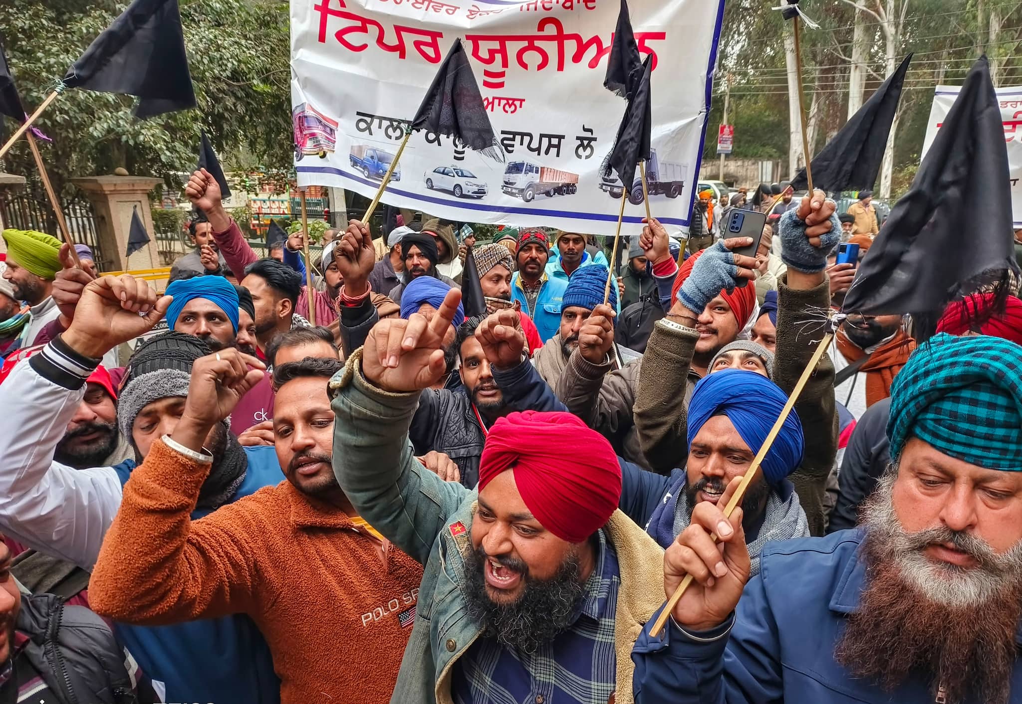 Long queues at petrol pumps amid truck drivers' protest over new hit ...