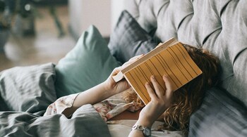 Lack of time and hours spent scrolling aimlessly are the usual suspects why we never get around to reading the books we want to read. But even after accounting for these factors, it seems odd that we dance the procrastination polka with an activity we anticipate being enjoyable and engaging. (Photo by Lina Kivaka via Pexels)