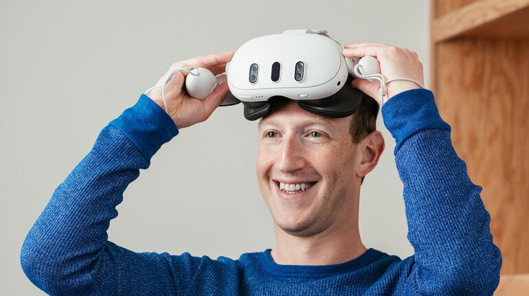 Mark Zuckerberg wearing a VR headset.
