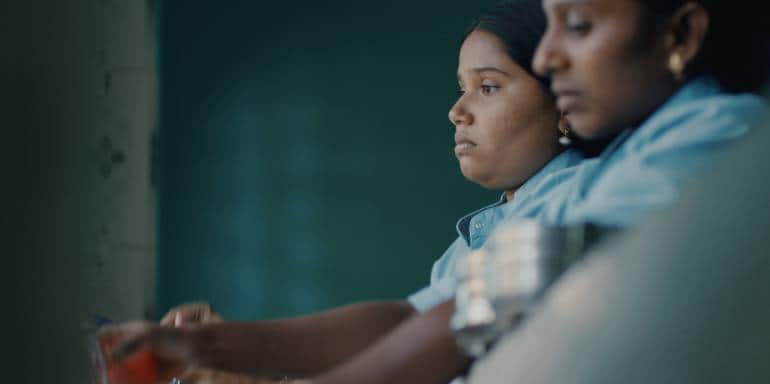 Anbarasi's Josie (left) who works in the factory in a still from the film.