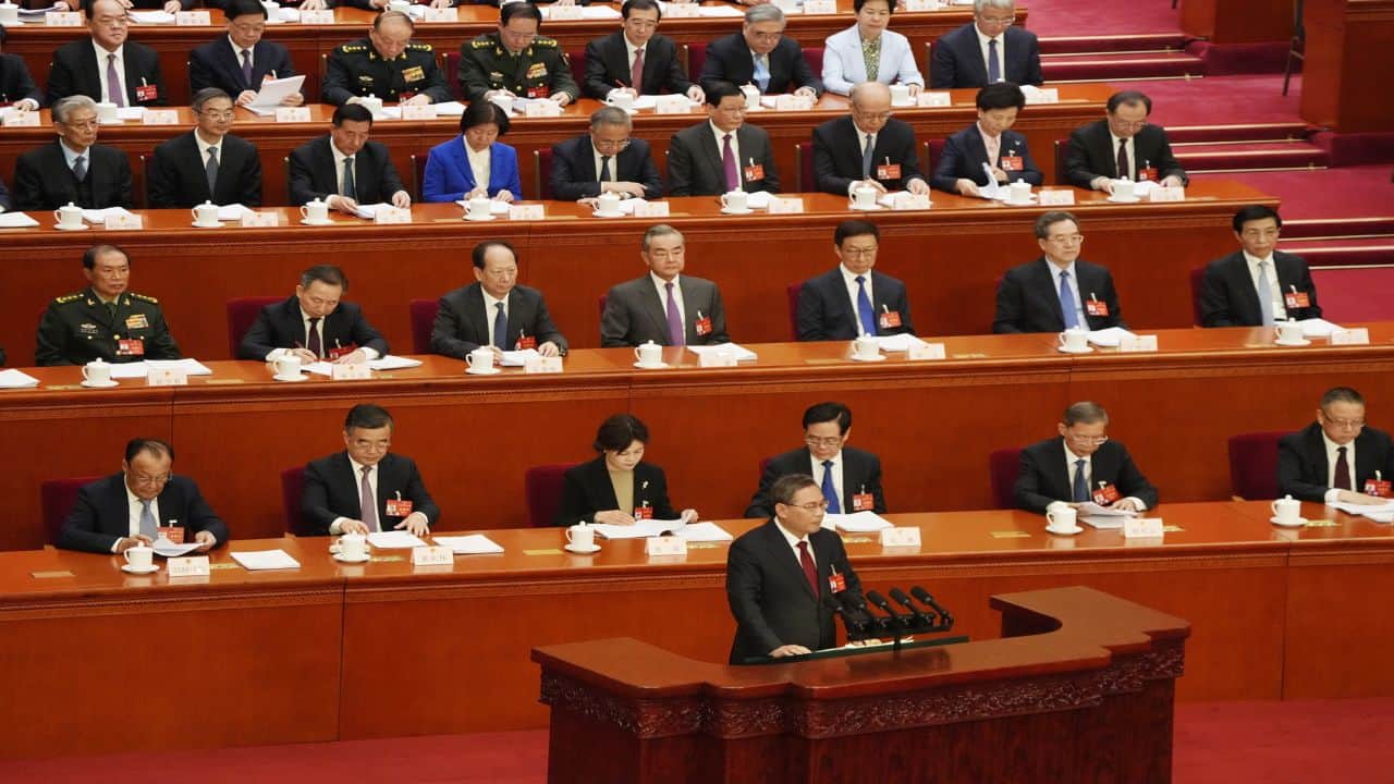 China says it will defuse financial risks at its top legislative meeting