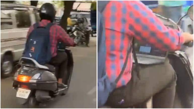 Bengaluru man attends work call while riding scooty. 'Things people do with company laptop' - Vimarsana News
