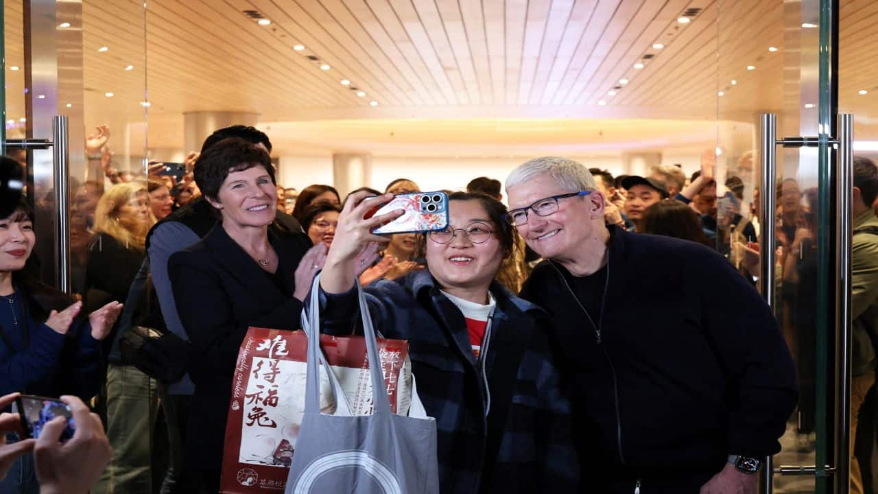 Apple's Tim Cook opens new store in Shanghai to large crowds as China ...