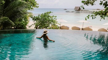 Some beach destinations stand out for their stunning scenery, tranquil atmosphere, and luxurious amenities. (Photo: Chelsea Gates via Unsplash)