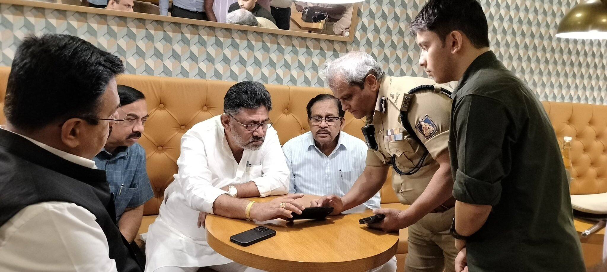 Karnataka Deputy CM DK Shivakumar, Home Minister G Parameshwara, and Bengaluru City Police Commissioner B Dayananda are in discussion.