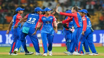 Delhi Capitals Jess Jonassen with teammates celebrates after taking the wicket of Gujarat Giants batter Ashleigh Gardner (PTI Photo)