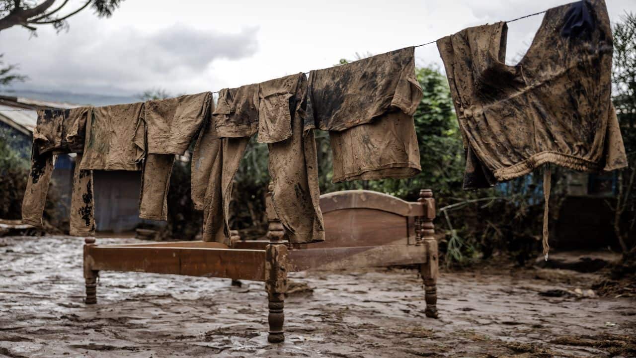 At least 46 people including children died when a makeshift dam burst its banks in Kenya's Rift Valley in the early hours of Monday, a local official said, as torrential rains and floods battered the country.