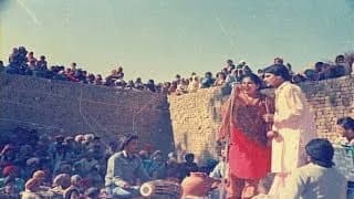 A screengrab of Amarjot Kaur and Amar Singh Chamkila in an akhada in Punjab. (Image: YouTube)