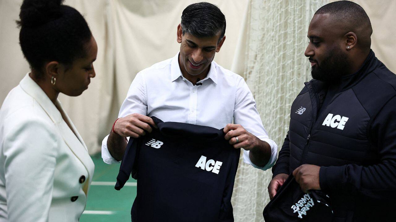 During the visit,the Britain's Prime Minister was presented with a jersey by ACE Programme founder Ebony-Jewel Rainford-Brent and Director of Programmes Chevy Green. (Image: Reuters)