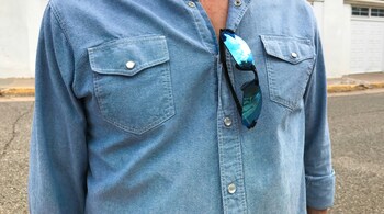 The casual yet chic style of a chambray shirt dress is perfect for both urban adventures and outdoor excursions. The breathable fabric ensures comfort in warm weather (Image: Canva)