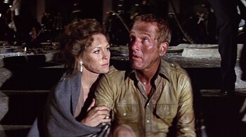 Faye Dunway and Paul Newman in The Towering Inferno (1974). While disaster movies often capitalize on spectacle, The Towering Inferno also explored themes of human fragility, and reflected the societal anxieties of its time. (Image source: X / Seventies Films @70sFilm)