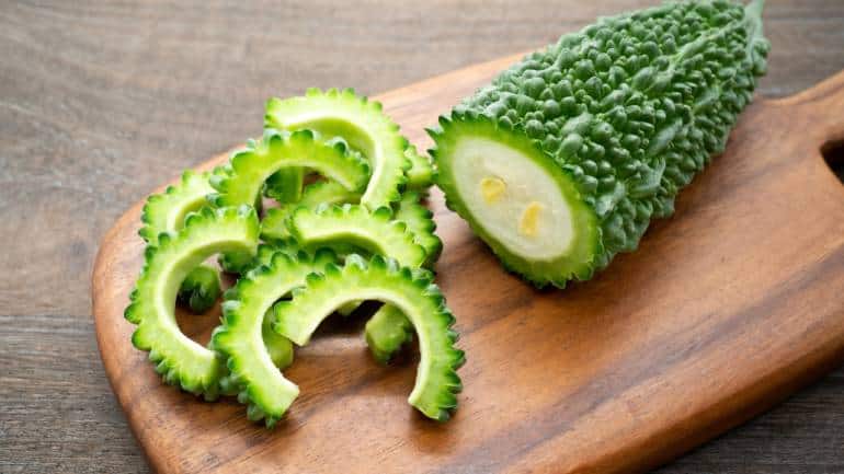 Bitter gourd: Yes, the kadva karela, is known for its detoxifying properties and is a staple for summer meals. Research suggests that bitter gourd contains antioxidants that help combat free radicals and support liver health. Therefore, despite its bitter taste, karela is a valuable vegetable to add to your summer diet for its health benefits, including aiding digestion and boosting immunity (Image: Canva)