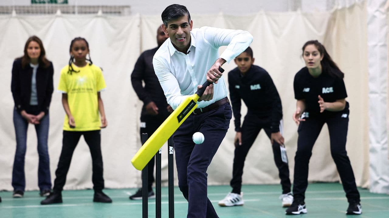 Britain's Prime Minister Rishi Sunak reacted as he is bowled out while taking part in a cricket practice session whilst meeting participants in the ACE Programme. (Image: Reuters)