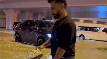 Singer Rahul Vaidya shared a video of him wading through flooded streets with sneakers in his hands outside a mall in Dubai.