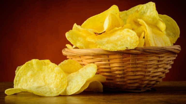 Chips: Store-bought chips, high in fat, have been linked to disturbances in sleep, potentially leading to unsettling dreams, says Khurrana. For a healthier alternative, consider homemade popcorn to curb late-night cravings (Image: Canva)