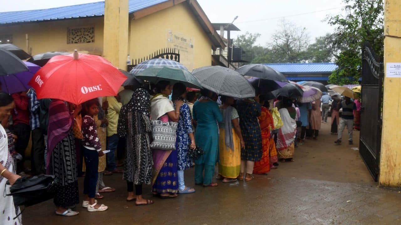 Guwahati: People stand in a queue to cast their vote for the third phase of Lok Sabha elections, in Guwahati, Tuesday, May 7, 2024. (PTI Photo) (PTI05_07_2024_000002B)