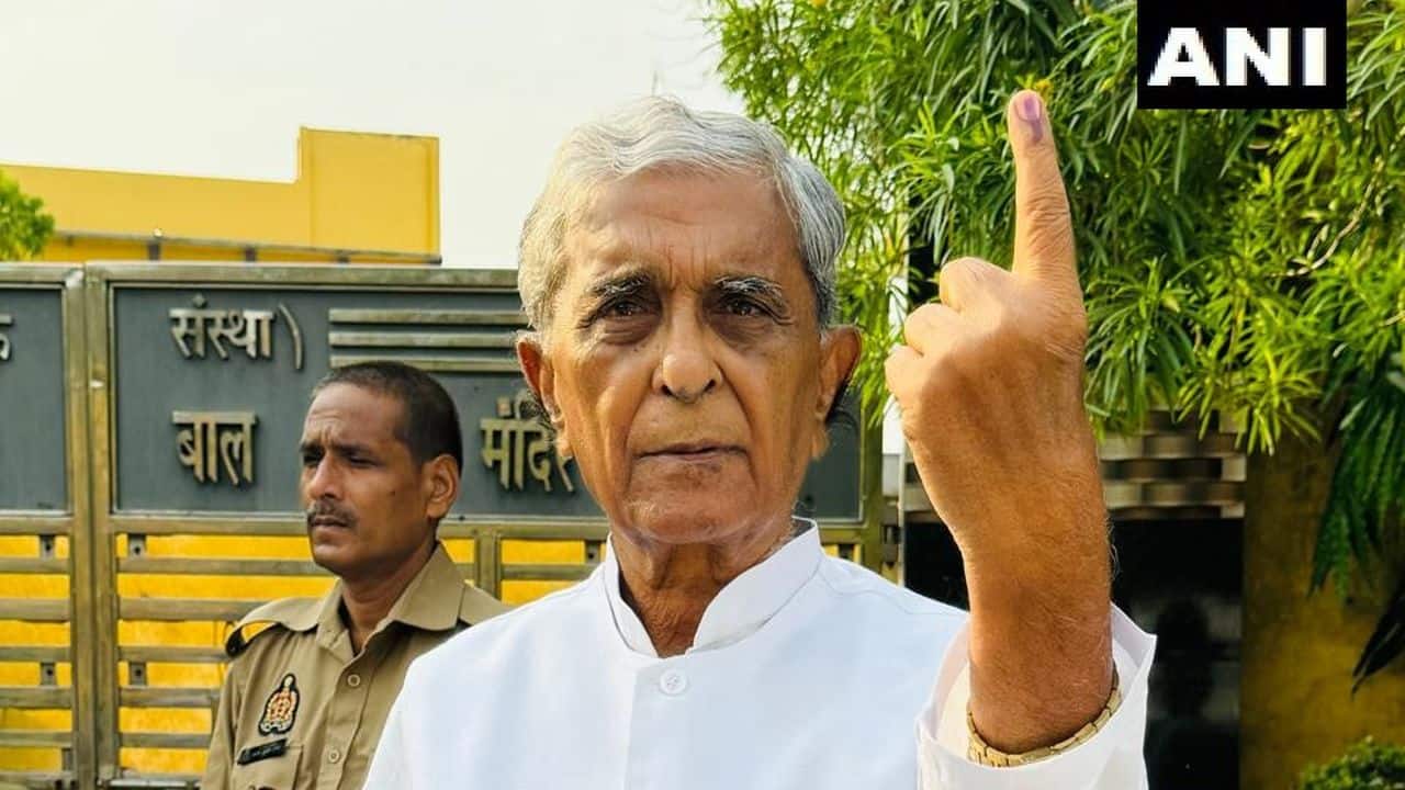 BJP leader Harnath Singh Yadav casts his vote at a polling booth in Etah, Uttar Pradesh