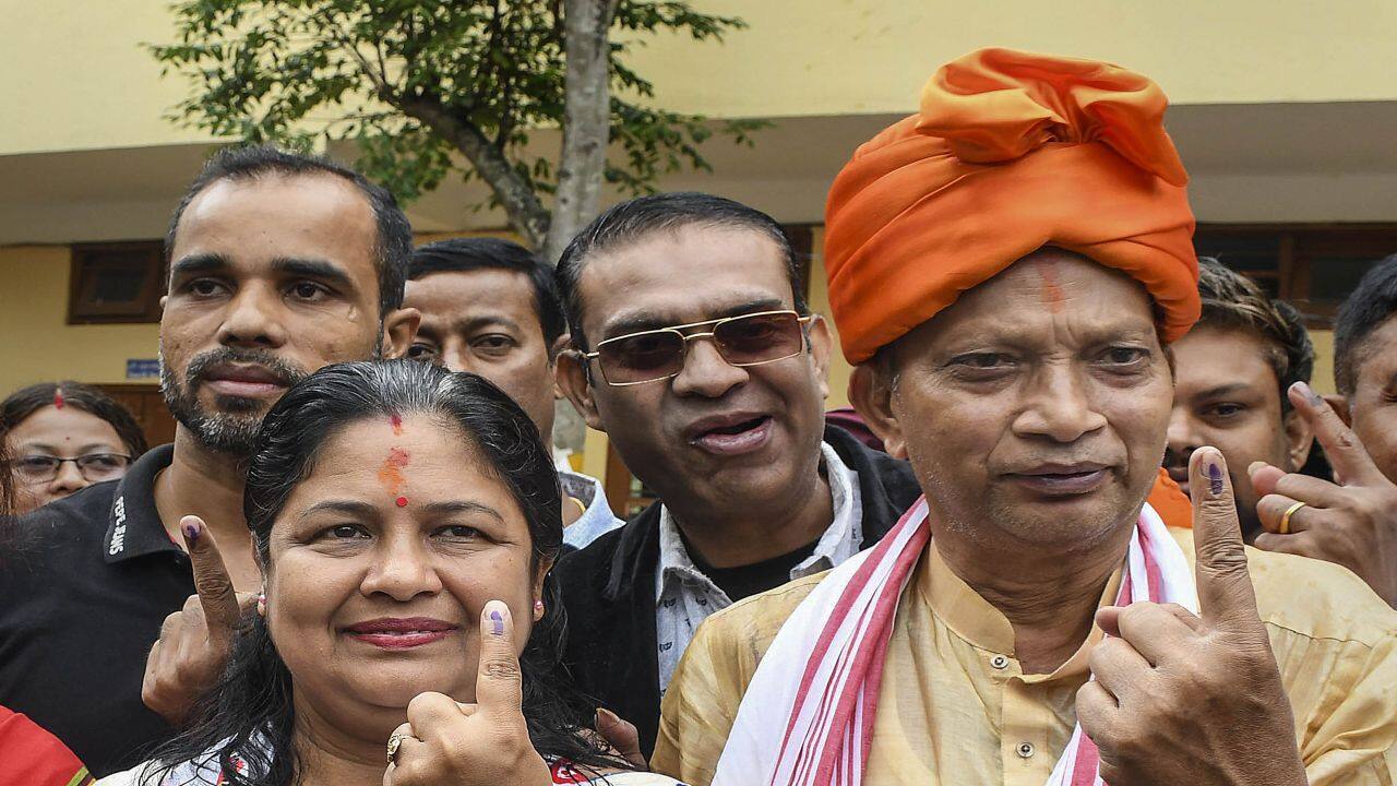 Guwahati: BJP candidate Bijuli Kalita Medhi with her husband shows her finger marked with indelible ink after casting votes at a polling station during the 3rd phase of Lok Sabha polls, in Guwahati, Tuesday, May 7, 2024. (PTI Photo) 