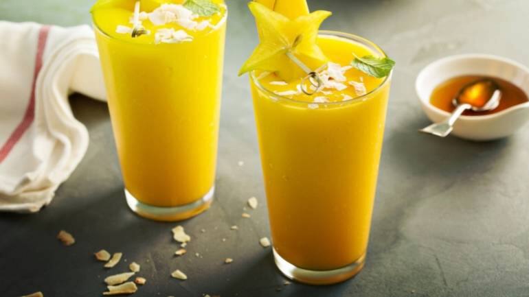 Mango and coconut refresher: Blend ripe mango chunks with hydrating coconut water and a splash of pineapple juice until creamy. Serve the refreshing concoction over ice for a taste of paradise on a hot summer day (Image: Canva)
