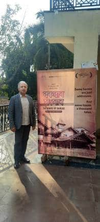 National Award-winning documentary filmmaker Utpal Borpujari with a promotional standee of his new film.