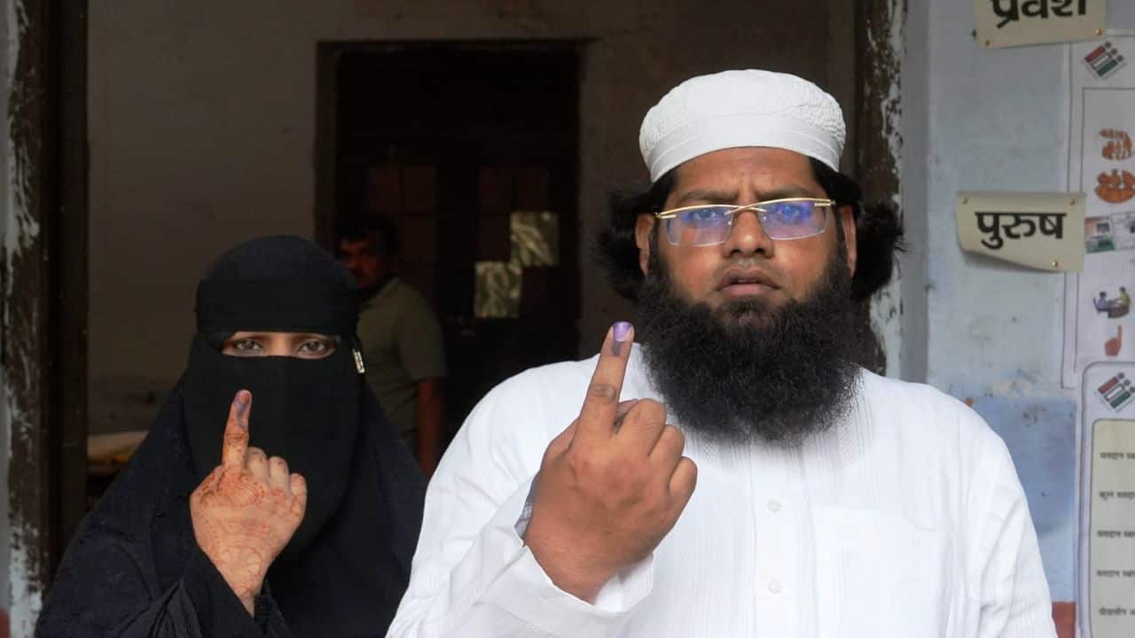 Voters show their fingers marked with indelible ink after casting their votes during the fourth phase of Lok Sabha elections, in Kanpur, Monday, May 13, 2024. Polling is underway in Uttar Pradesh's 13 seats in fourth phase of Lok Sabha polls. (PTI Photo/Arun Sharma)