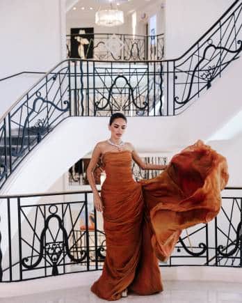 Diipa Khosla in a golden brown gown.