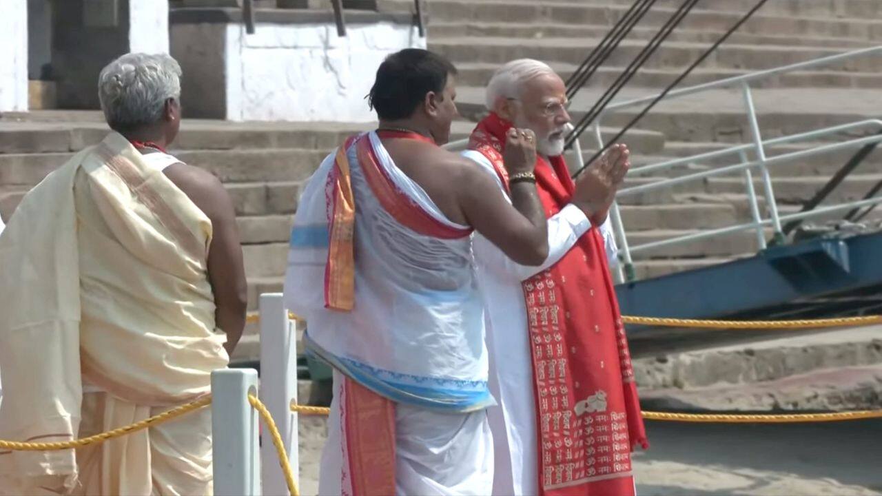 **EDS: SCREENSHOT VIA @narendramodi.in** Varanasi: Prime Minister Narendra Modi performs 'Ganga Poojan' at Dashashwamedh Ghat, in Varanasi, Uttar Pradesh, Tuesday, May 14, 2024. (PTI Photo) (PTI05_14_2024_000024B) *** Local Caption ***