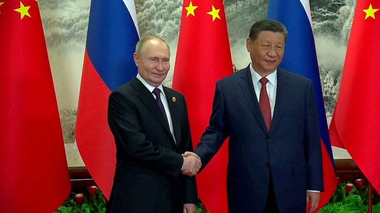 Vladimir Putin in trade push on final day of China trip