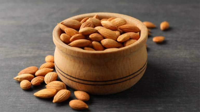 Health benefits of almonds: Nuts like almonds, walnuts, and pistachios are excellent sources of healthy fats, fiber, and protein, which help lower LDL cholesterol and improve endothelial function (Image: Canva)